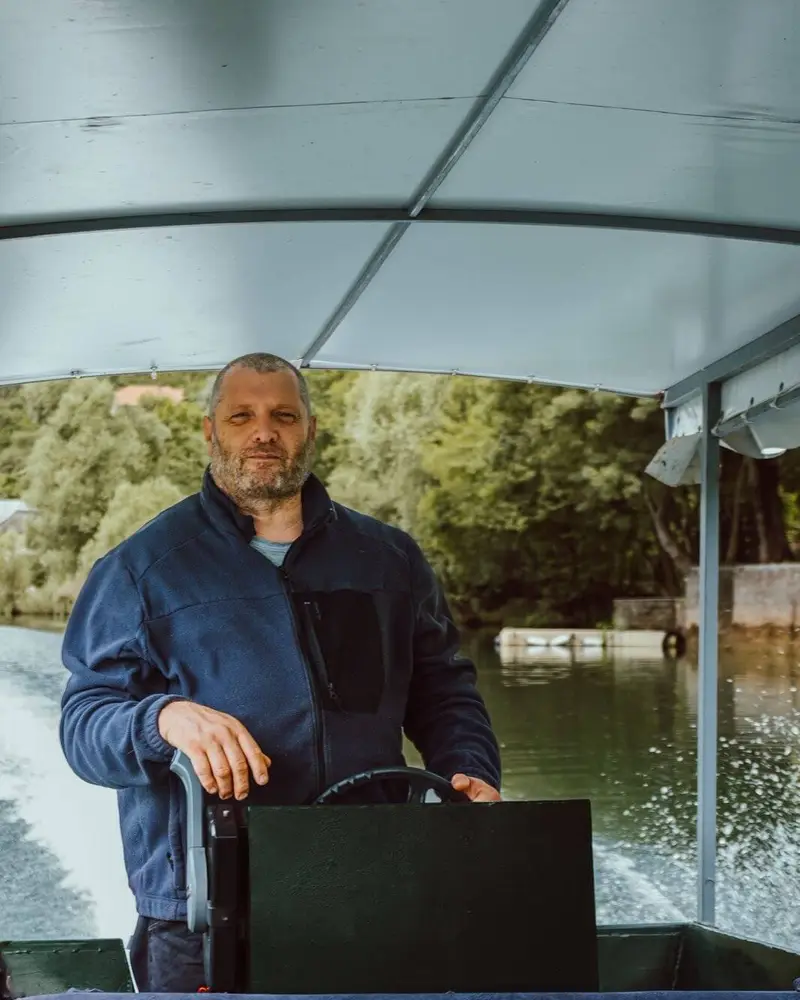 Captain Duško on his boat on Skadar Lake